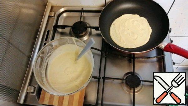 Spread the dough in a very thin layer on a baking sheet.
