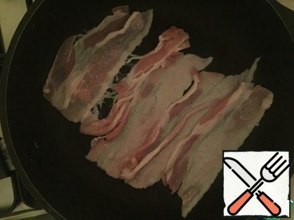 Fry the bacon.