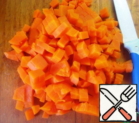 Boil the carrots and cut them into small cubes.