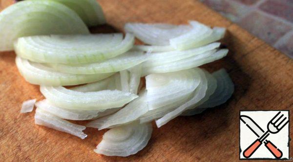 Chop the onion into half rings and soak for 20 minutes in vinegar solution (add 1/3 Cup of vinegar to 1 Cup of water).