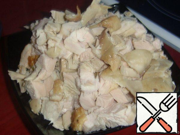 Cut cooked or raw chicken meat into cubes.