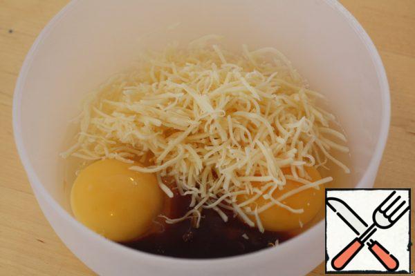 Mix eggs, cheese, soy sauce, and black pepper (optional) in a bowl.