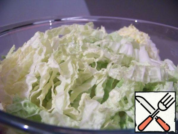 Chop the cabbage (or lettuce leaves) and mash it a little with salt.