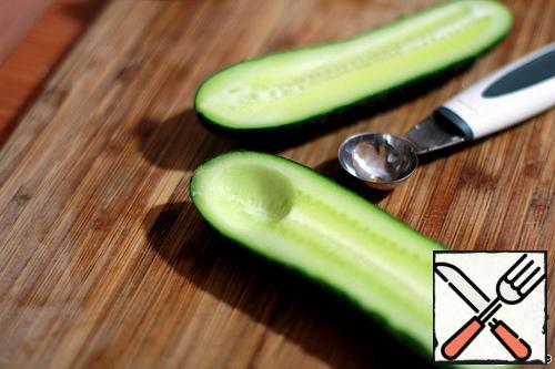 Cucumbers cut in half, cut the middle.