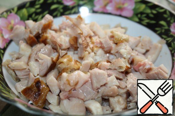 Cut the chicken breast into cubes.