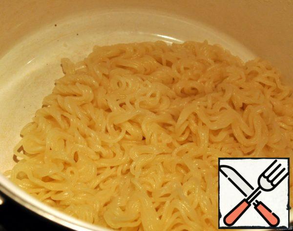 Boil the noodles.