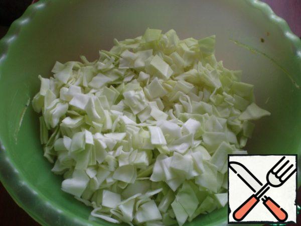 Cut the cabbage into squares.