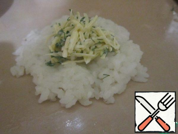 Stuff the rice with the cheese mixture and roll the balls.