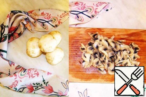 Wash the mushrooms and boil them in salted water for 5 minutes. Cool and cut into thin plates.