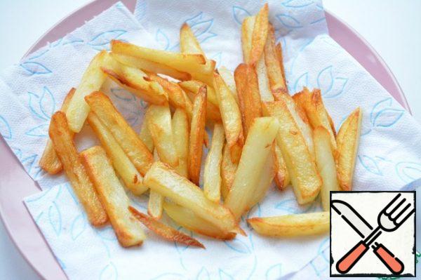 After the potatoes are cooked, put them on a plate covered with a paper towel (or, like mine, just napkins) so that all the fat is drained.