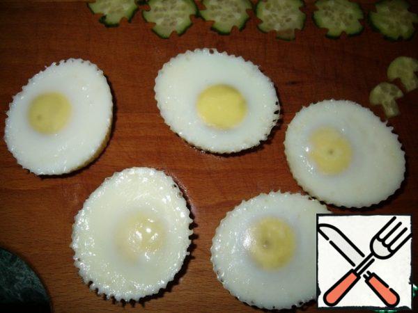 Carefully remove from the molds, turning them over in the palm of your hand.