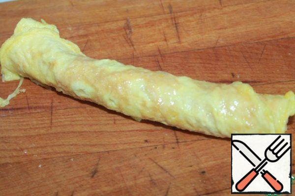 Roll up the egg pancake.