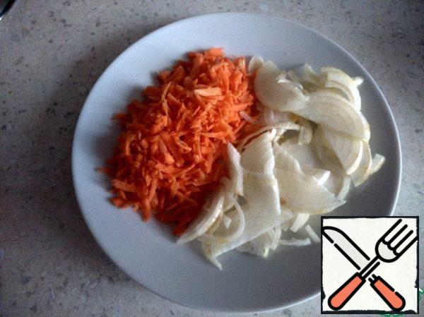 Onion cut into half rings, carrots three on a large grater.