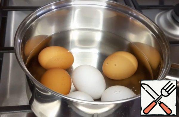 Boil the hard-boiled eggs.