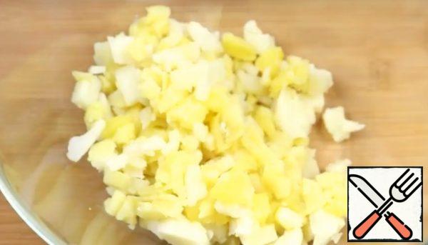 Boil the potatoes until tender and cool.