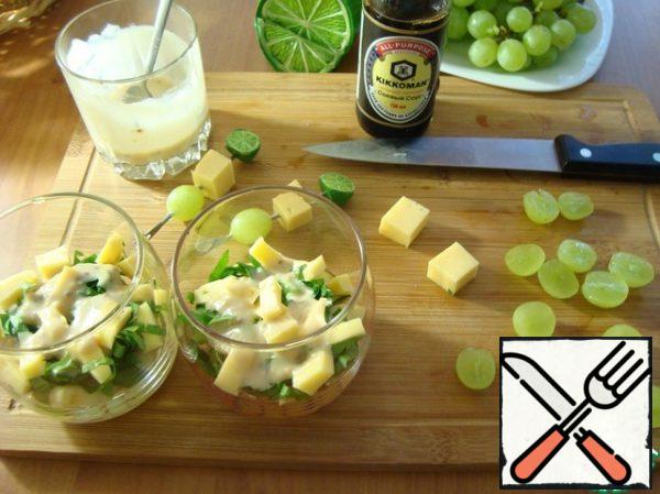 Put the celery on the apples and pour the dressing with a spoon. Then cheese in small cubes, again - dressing. Grapes-top layer and pour the remaining dressing.