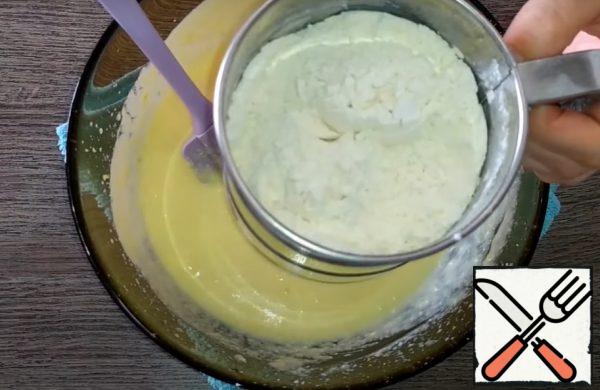 Separately mix the flour with baking powder and add to the liquid ingredients in 2-3 doses.