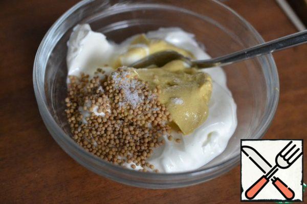 Mix yogurt, mustard and mustard seeds. Season with salt and pepper. Mix well.