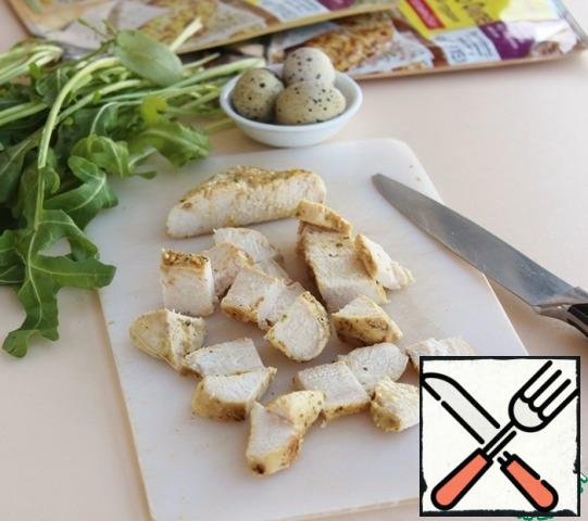 Cut the chicken breast into pieces.