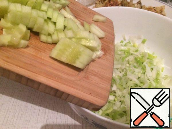 Cut the peeled cucumbers into cubes.