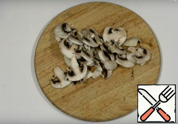 Cut the mushrooms.
