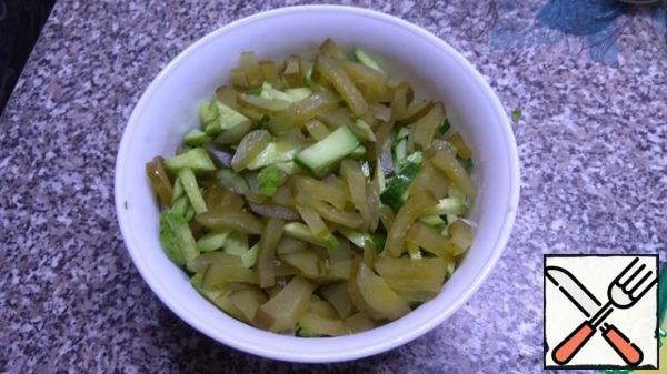 Next, cut in wedges cucumbers (fresh+salt).