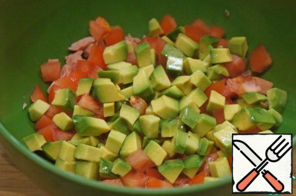Add the avocado, cut into the same small cubes.