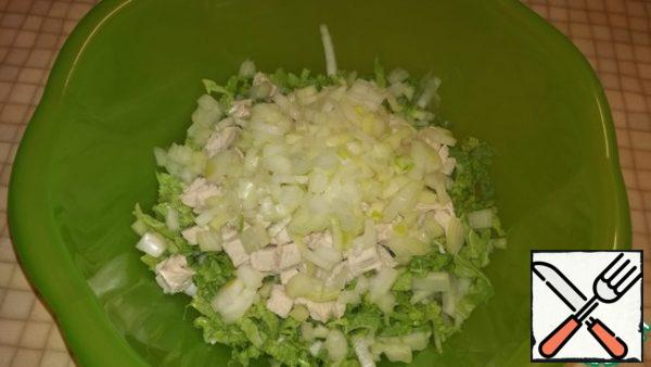 Finely chop the onion and add it to our salad.