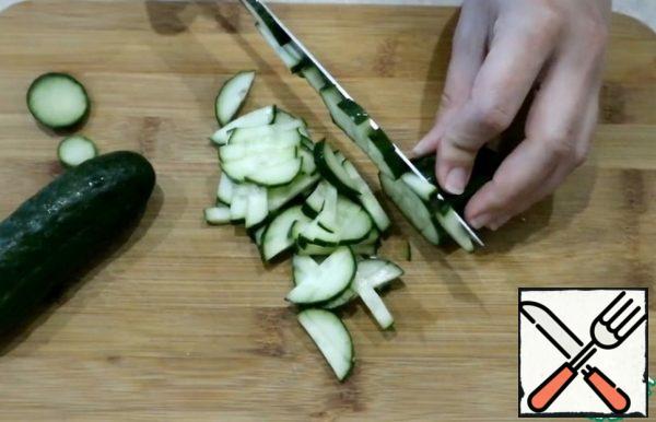 Cut the cucumbers into strips.