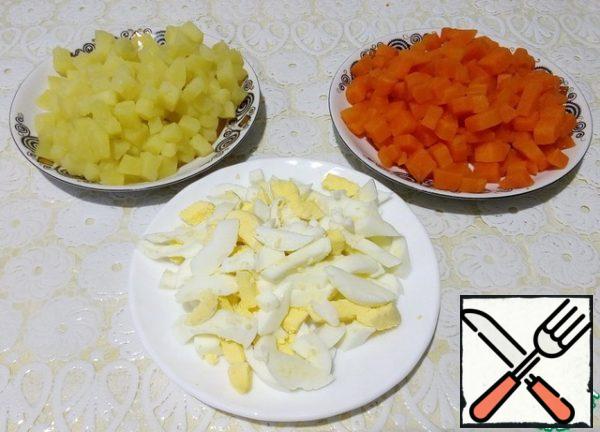 Boiled chicken eggs cut into strips.