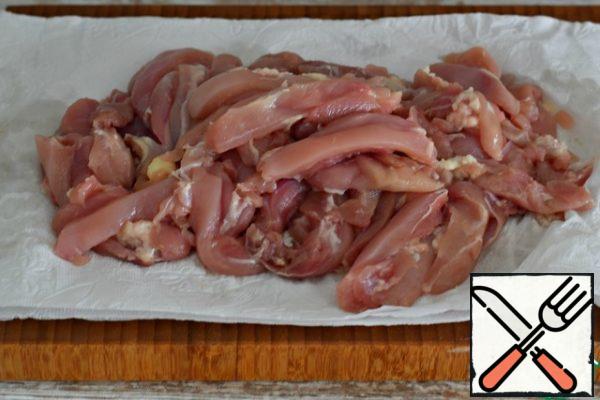 Dry the chicken fillet (breast or thigh) with a paper towel and cut into large strips.
