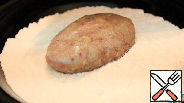 Roll in flour.