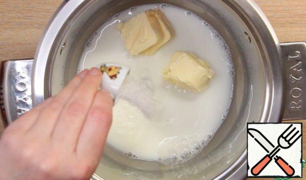 Pour the milk and water into a saucepan, add butter, sugar, and salt.