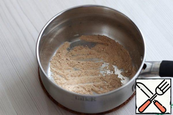 Add flour (2 tablespoons) to the saucepan. Fry the flour over low heat until light beige without adding oil.