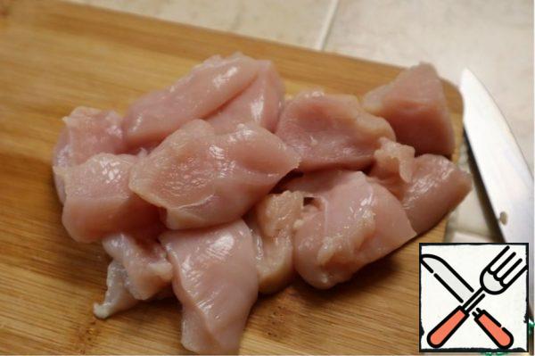 Chicken fillet cut into convenient cubes, you can immediately add salt.