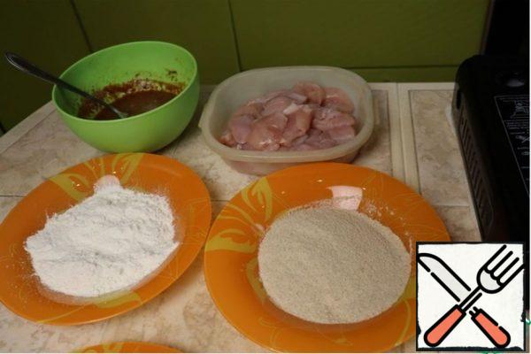 Now you need to dip each piece of chicken in the egg mixture, and then roll in flour. You need to let the chicken dry for 3-4 minutes, so the flour will stick better to the meat and will not fall off in the pan.