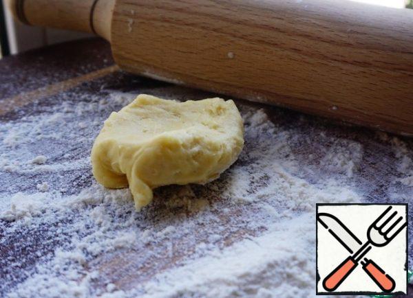 Pinch off small pieces of dough.