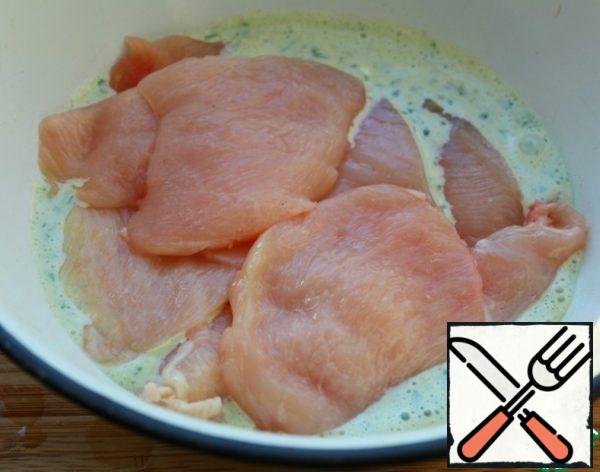 Cut the Breasts into chops — adjust the thickness and size yourself. With a knife or fork to poke into pieces of chicken, if someone does not have a tenderizer, I poked with a fork.
Put the Breasts in a container fill with marinade