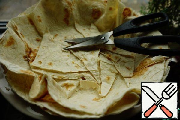 If we use pita bread, we cut off the extra "tails".