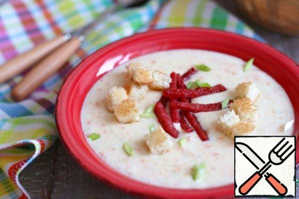 Pour the soup-puree on plates, add croutons and fried pieces of sausage or bacon. Sprinkle green onions on top. Bon Appetit!