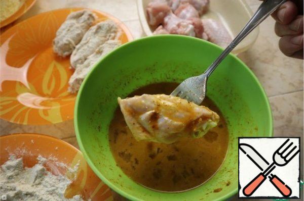 Dip the chicken in the egg mixture.