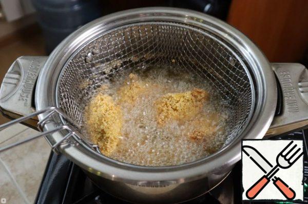 Dip the chicken in the oil, I repeat - I used a deep fryer.