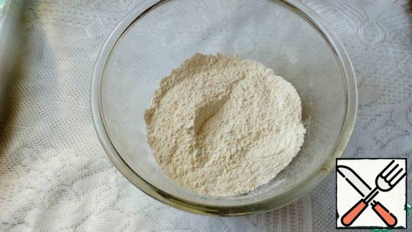 Sift the flour into a bowl, add baking powder and corn starch and mix.