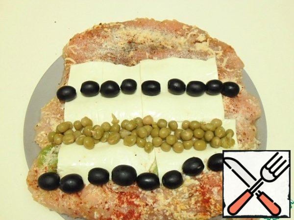 I put plates of cheese, olives and peas on it.