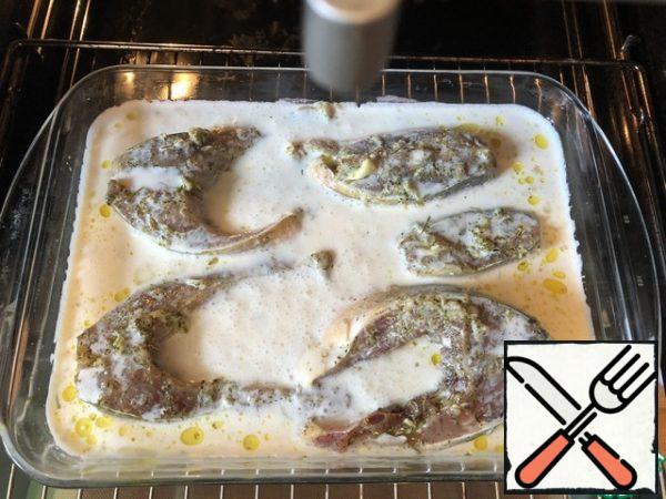 Put the pieces of fish in a greased form and pour the sour cream sauce over them. Place in the oven and bake for 35-40 minutes.
In the process of baking (1-2 times) pour the sauce over the fish pieces.

Rice is ideal as a side dish.

Enjoy your meal!