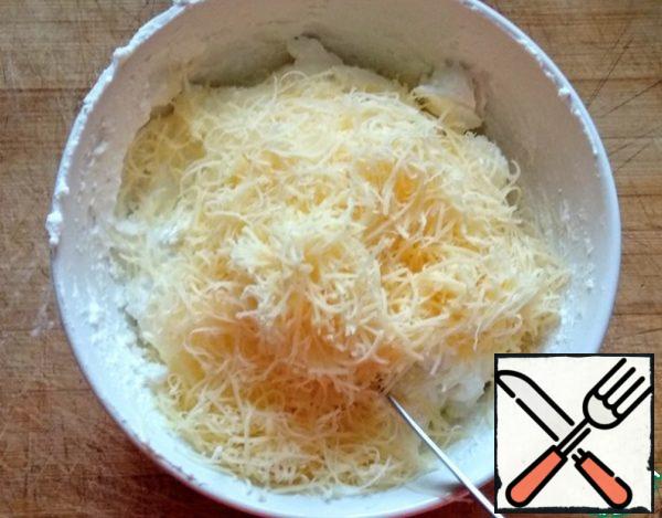 Add the cheese, grated on a fine grater, and mix.
