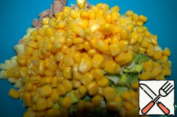 Add grated cheese, onion and corn to the meat.