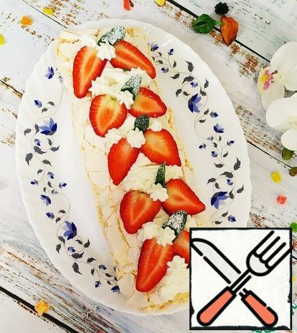 For decoration, beat the curd cheese, ricotta and powdered sugar in a bowl. Transfer the resulting cream to a pastry bag and decorate the roll. top with fresh berries and mint leaves.