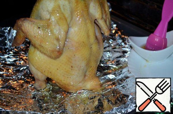 During baking, grease the chicken several times with a honey-oil mixture.