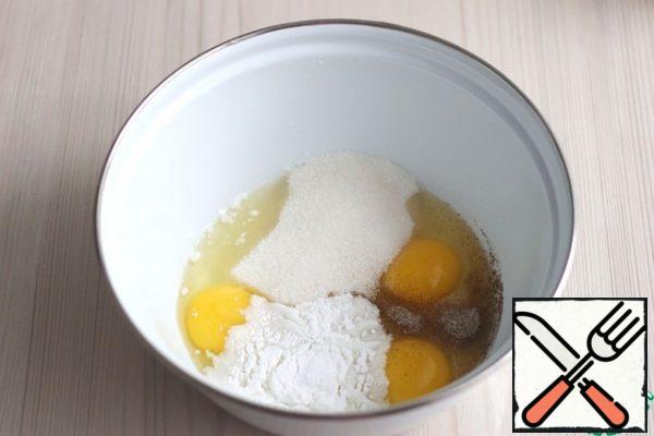 In a bowl, pour eggs (3 pcs.), pour vanilla sugar (1 stack.), pour baking powder (1 stack.), pour sugar (90 gr.). Beat the mixture with a mixer.